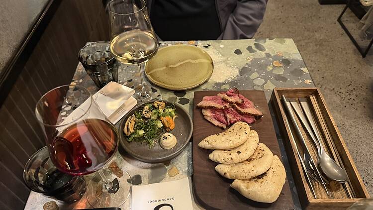 Small plates that hit the spot, like this pita pocket of picahna steak, mussels and salad.