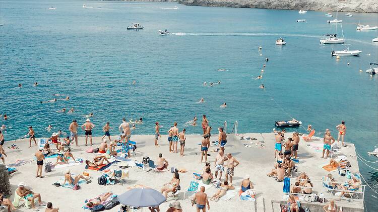 Puglia, Italy a large group of people are on the beach
