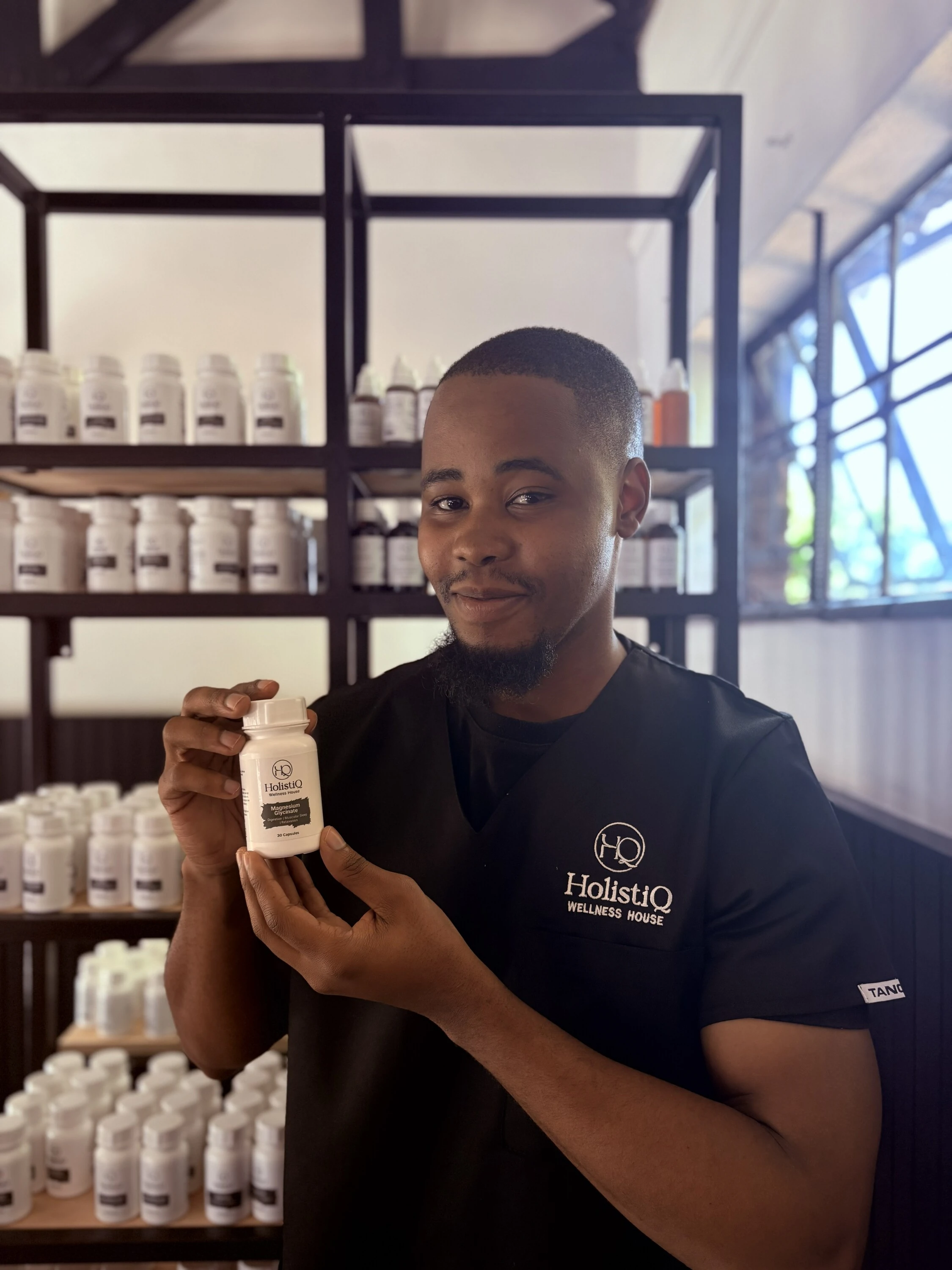Notha Buthelezi holding his product 