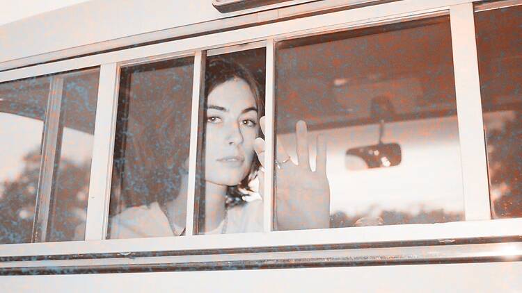 House/Music a young woman on a bus in black and white