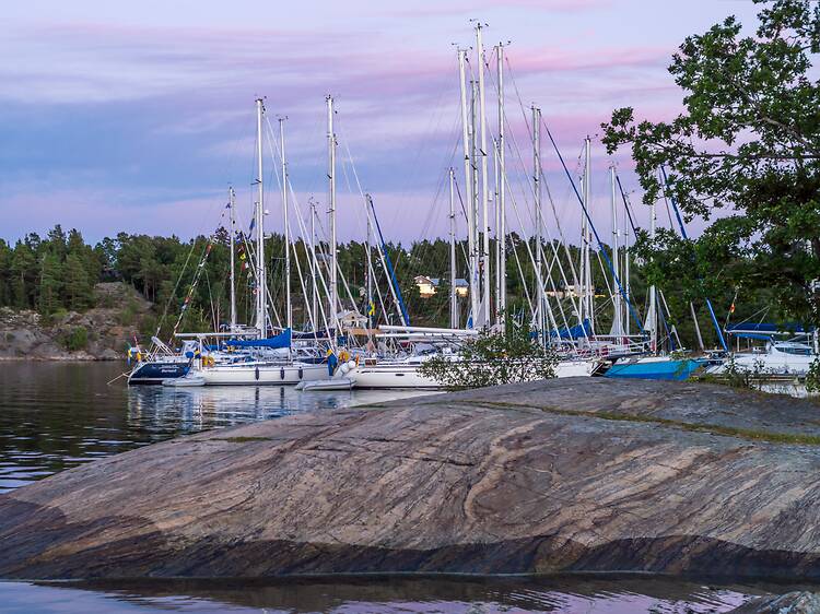 Jump barefoot on the rocks in the Stockholm archipelago Jump barefoot on the rocks in the Stockholm archipelago