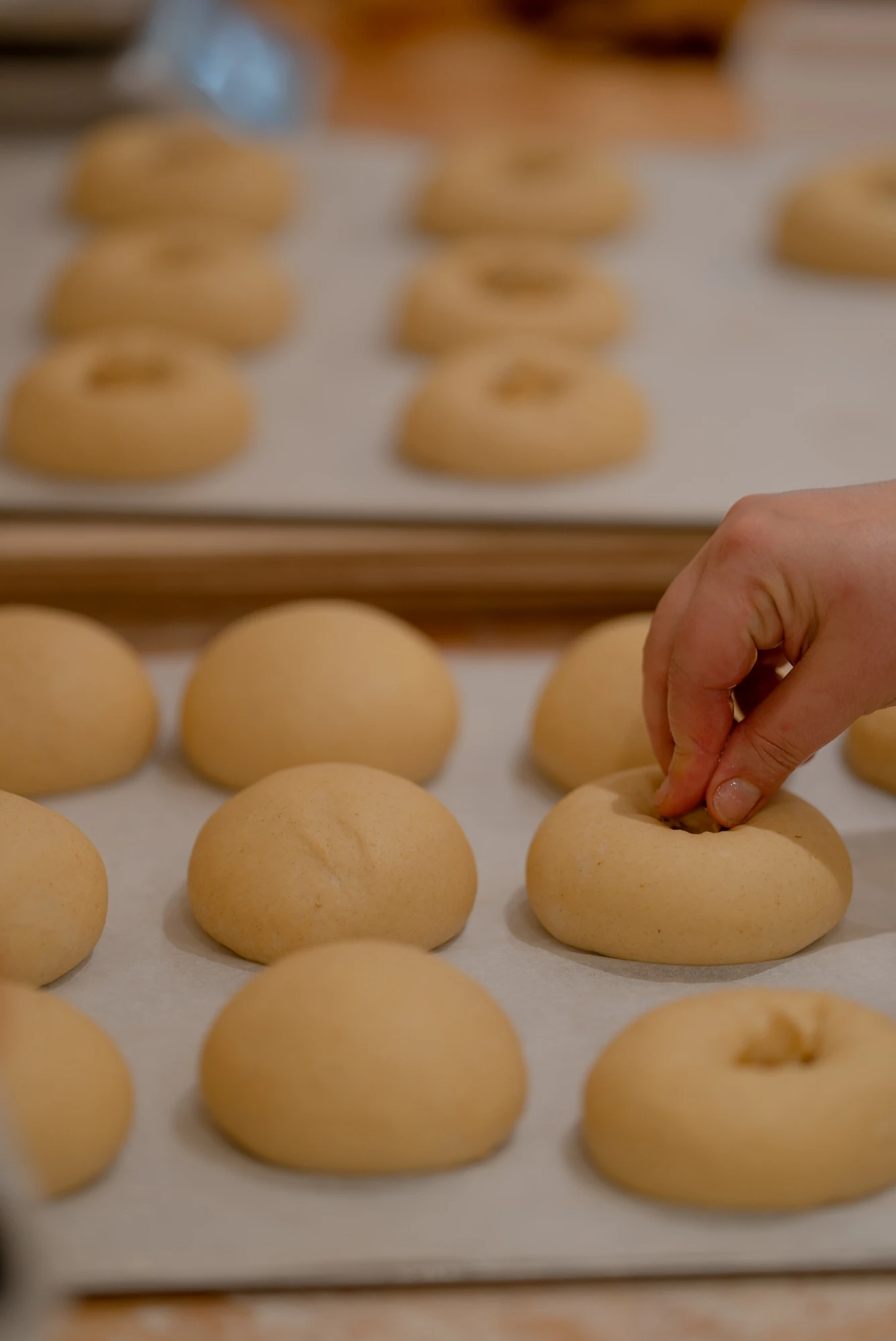 Uncooked buns on trays at Quince Bakery