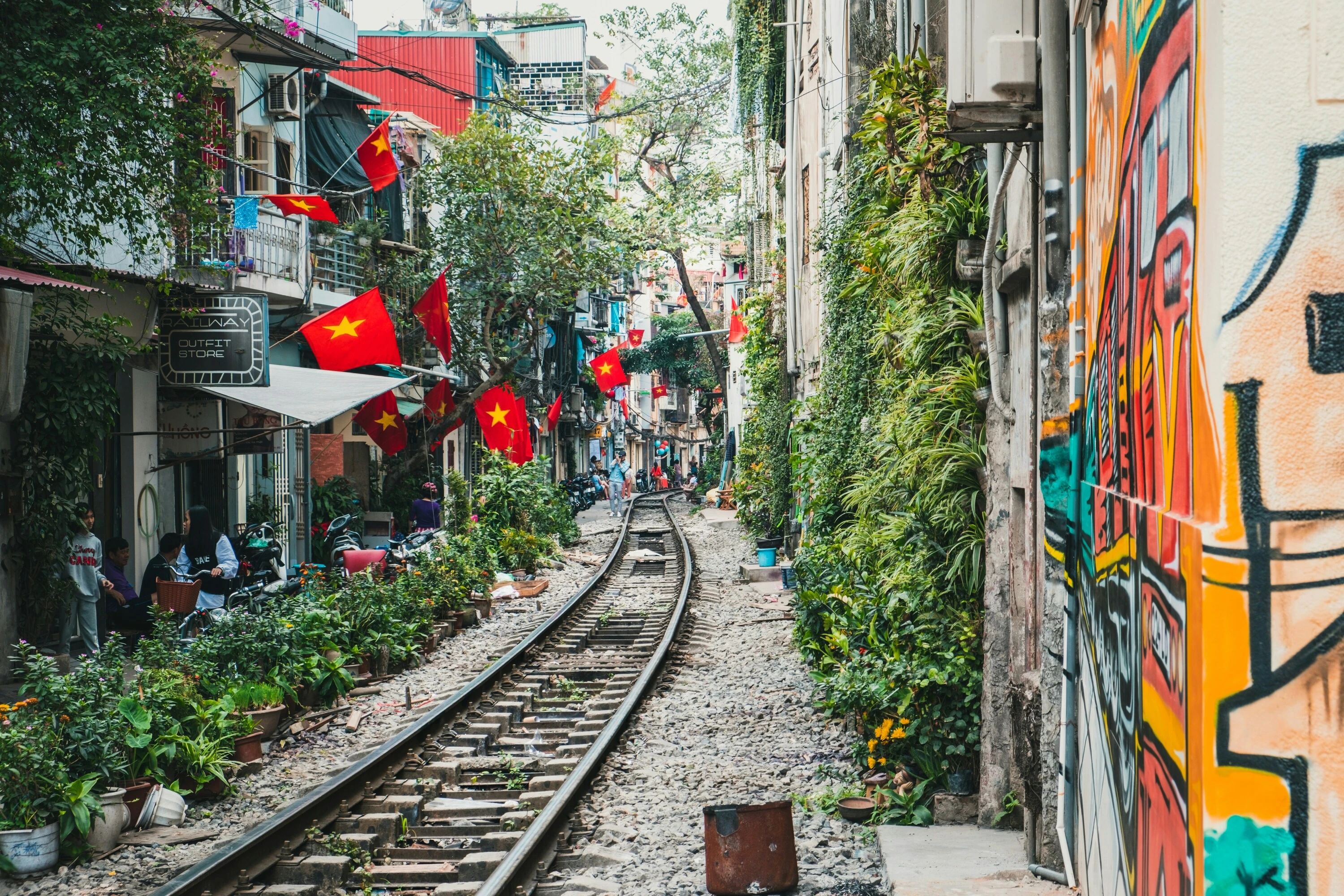 Train track surrounded by houses