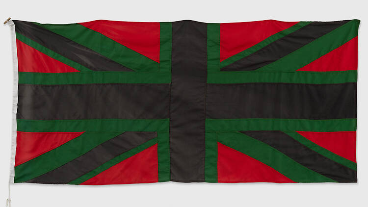 A textile by Chris Ofili featuring a red, green and black Union Jack flag A textile artwork by Chris Ofili featuring a red, green and black Union Jack flag