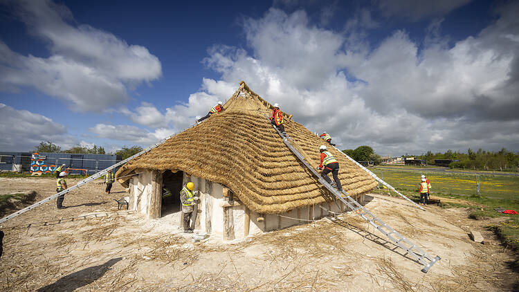 Volunteers help in the construction of The Kusuma Neolithic Hall near Stonehenge in Wiltshire