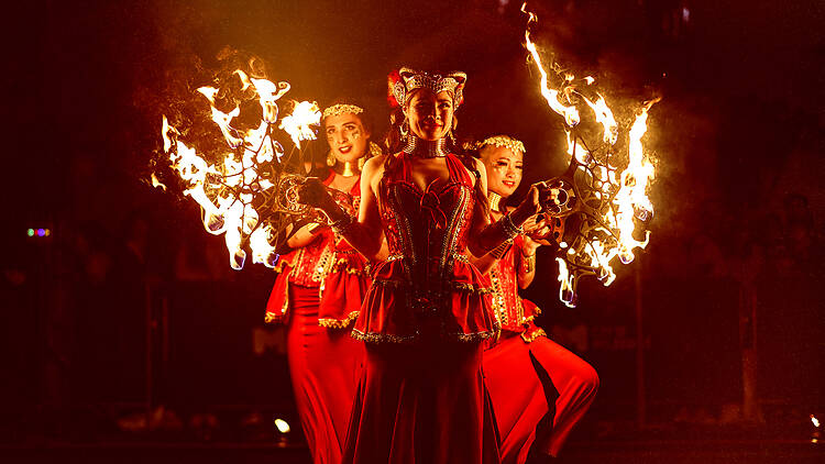 Three fire dancers.