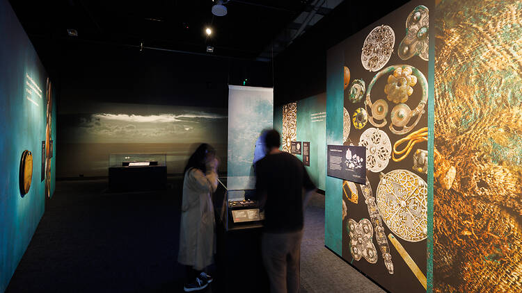 Treasures of the Viking Age: The Galloway Hoard Two people at a Viking Age exhibiton