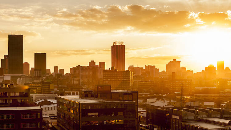 Johannesburg city with the sun setting in the background