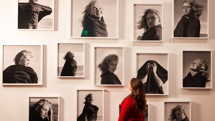 ‘Marilyn Monroe: A Portrait’ at the National Portrait Gallery A visitor observing ‘Marilyn Monroe’ (1946) by André De Dienes
