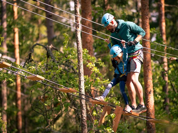 Take on a high ropes course at Högt & Lågt Take on a high ropes course at Högt & Lågt