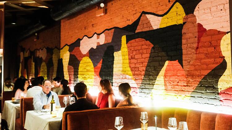 A painted mural in a dining room.