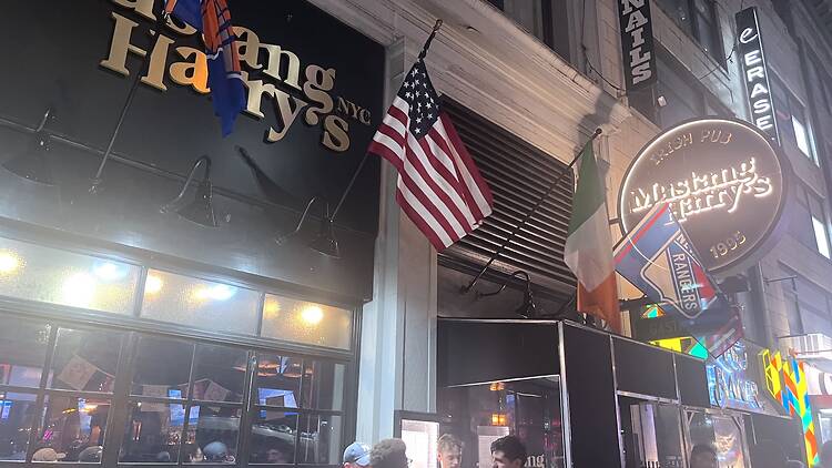 Outside of Mustang Harry's with people gathering outside