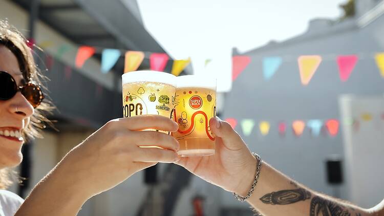 Time Out Market Two hands cheersing with beers