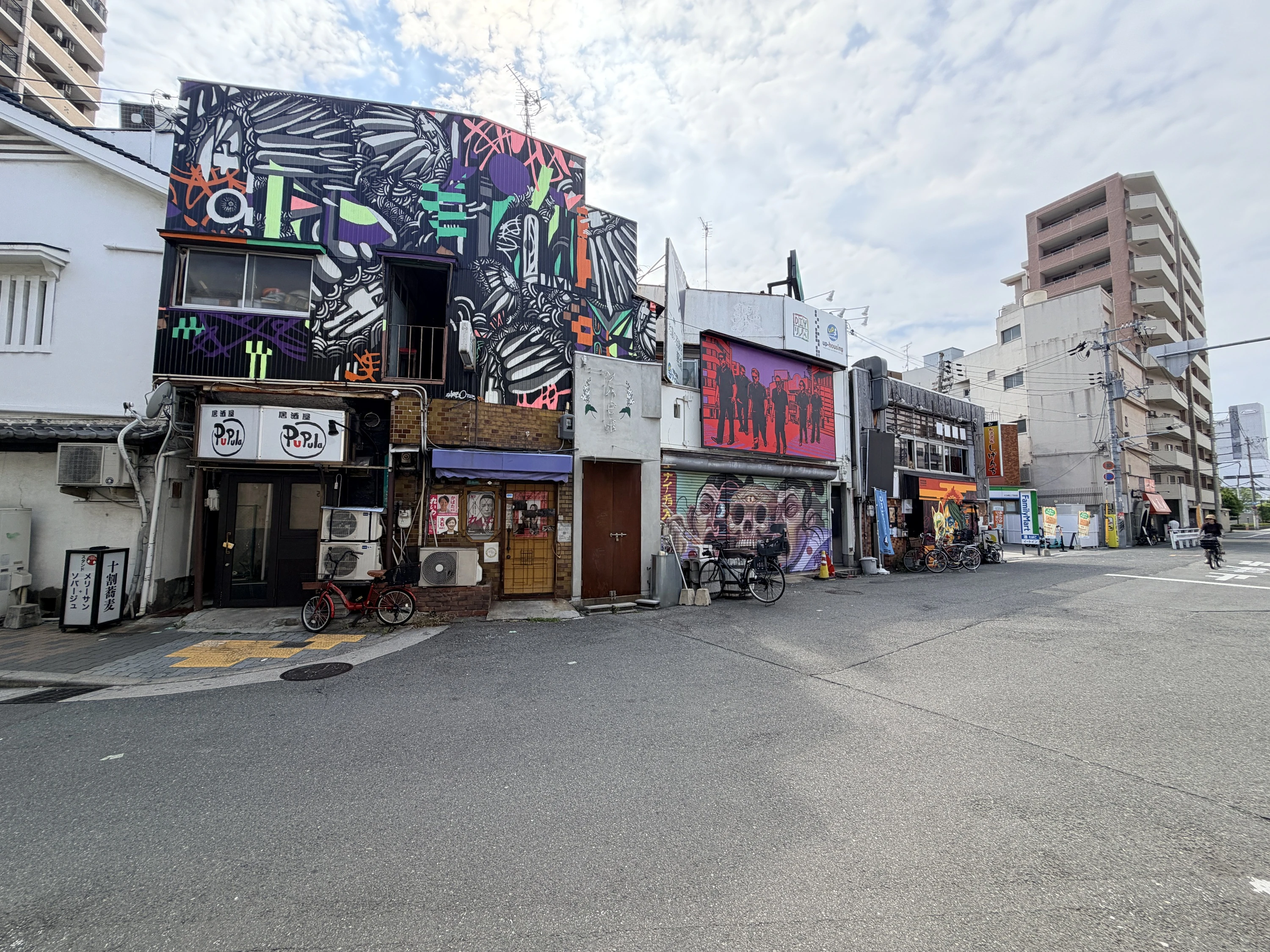 Mural by Darbotz (left) in Juso, Osaka