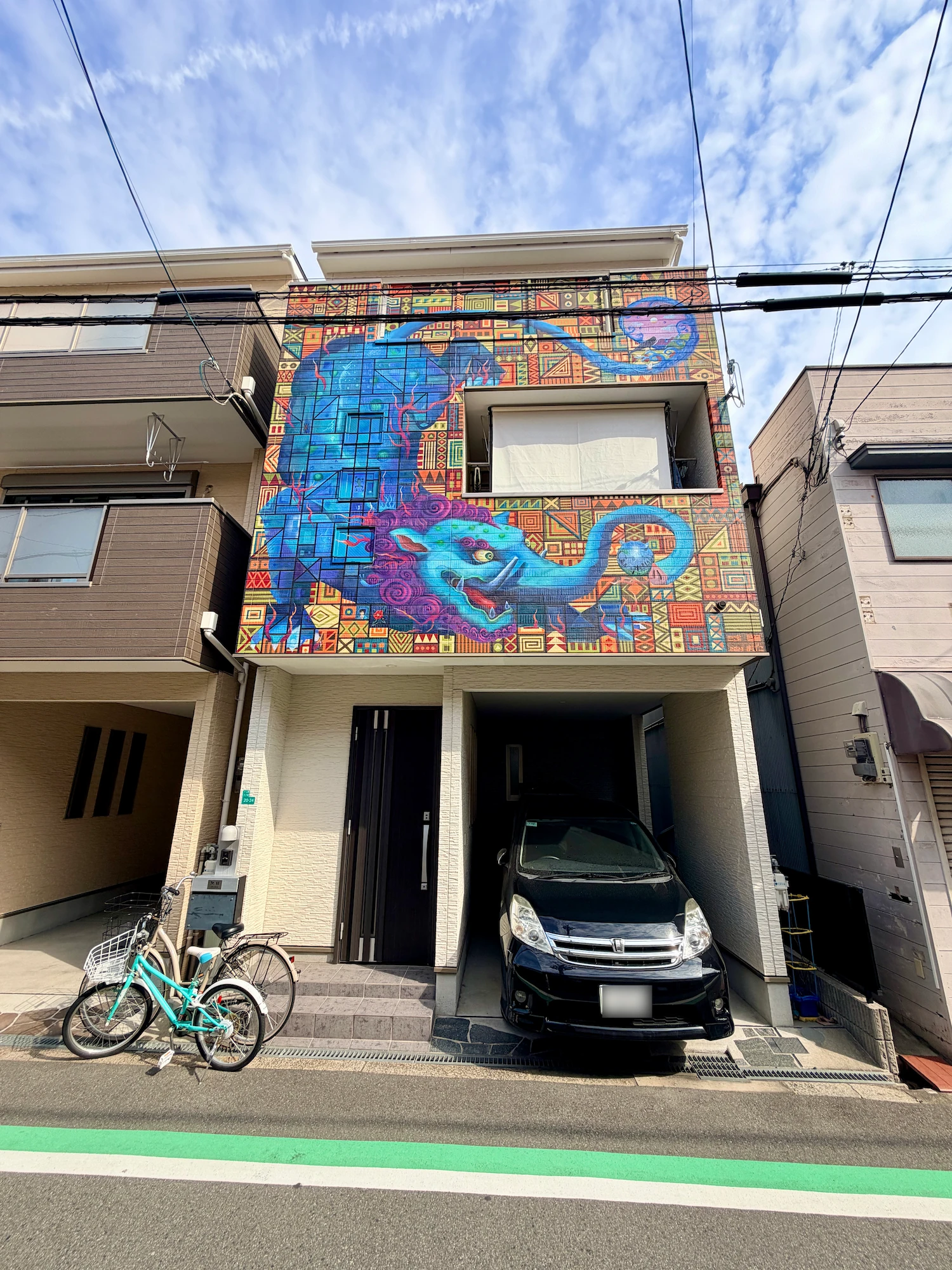 Mural by Gaimon and Kimi on the Yodokabe Trail in Juso, Osaka
