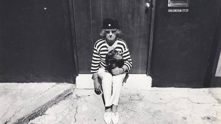 Brett Whiteley with pet terrier at his Raper Street studio, 1988