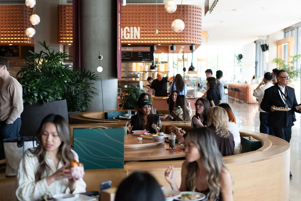 People eating at the newly-opened Time Out Market Vancouver food hall