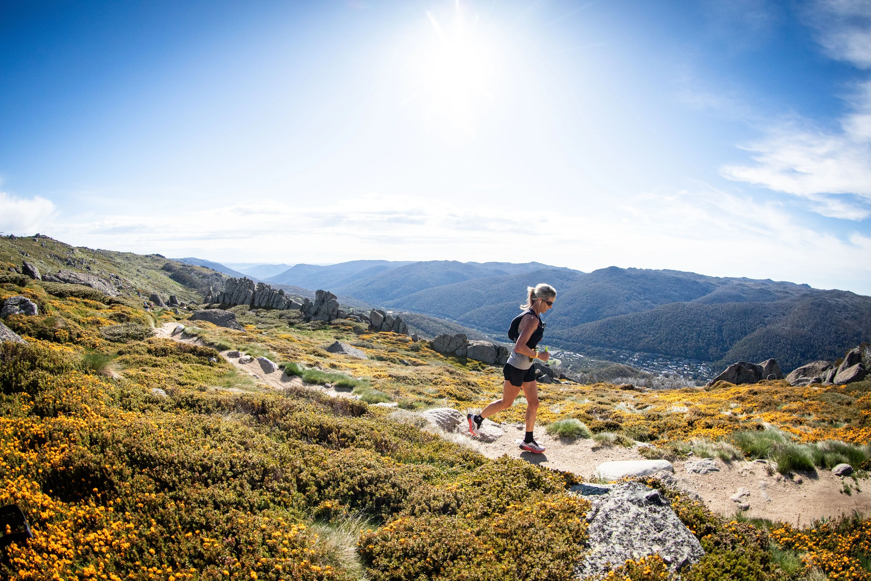 Woman taking part in Ultra-Trail Kosciusko by UTMB event in Kosciuszko National Park.