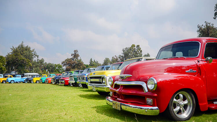 Vintage car show and exhibition of Chevrolet pick-up trucks Vintage car show and exhibition of Chevrolet pick-up trucks and chevy cars outdoors. Red chevy classic vehicle parked in a retro event.