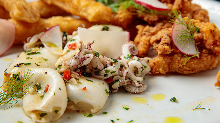 Start with seared baby calamari. Start with seared baby calamari.