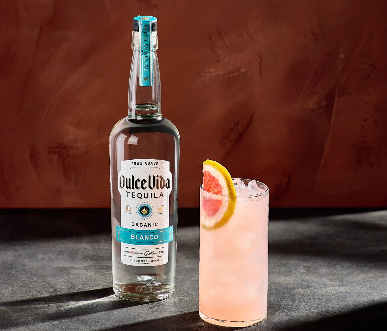 The Skinny Paloma by Dulce Vida is pink with a grapefruit slice in it