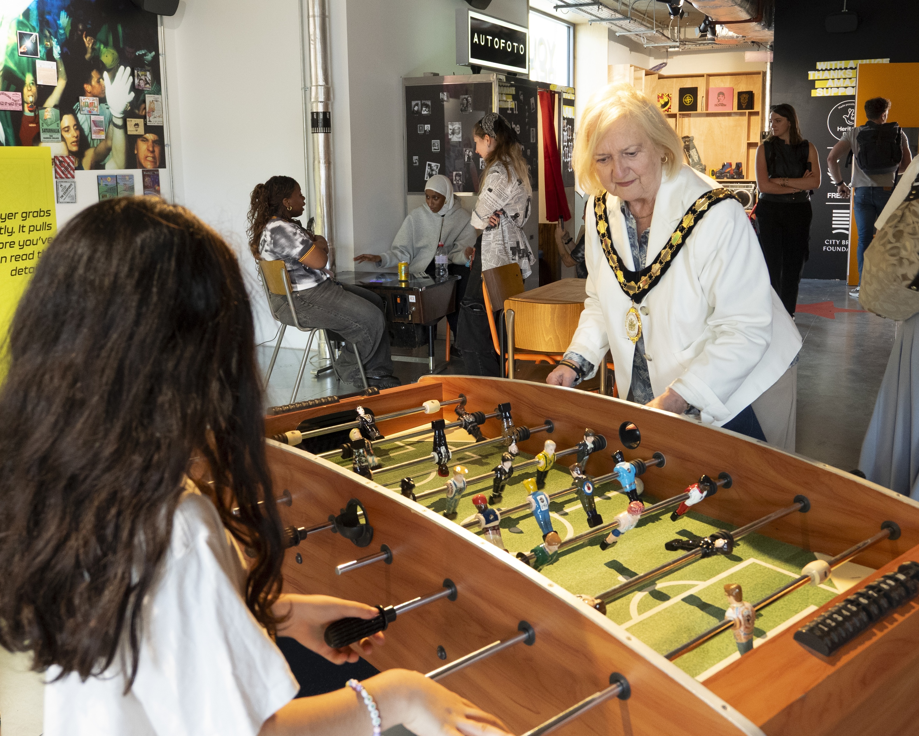 Two people playing foosball at the Museum of Youth Culture