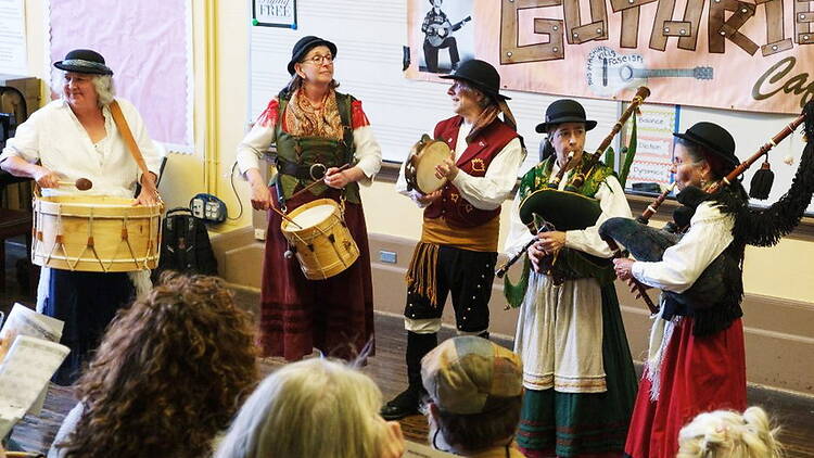 A wide shot of people playing an instrument