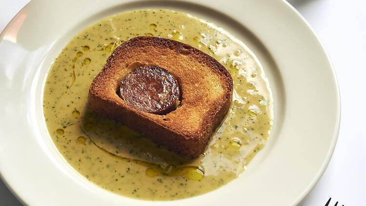 sausage in brioche bread and sauce
