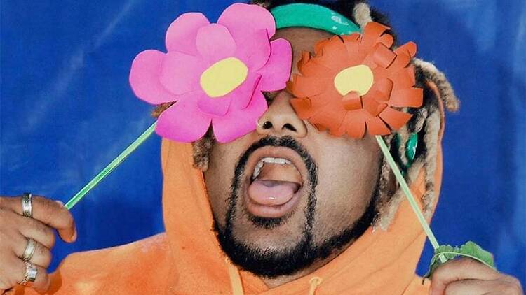 Immy Owusu Musician Immy Owusu with flowers over his eyes.