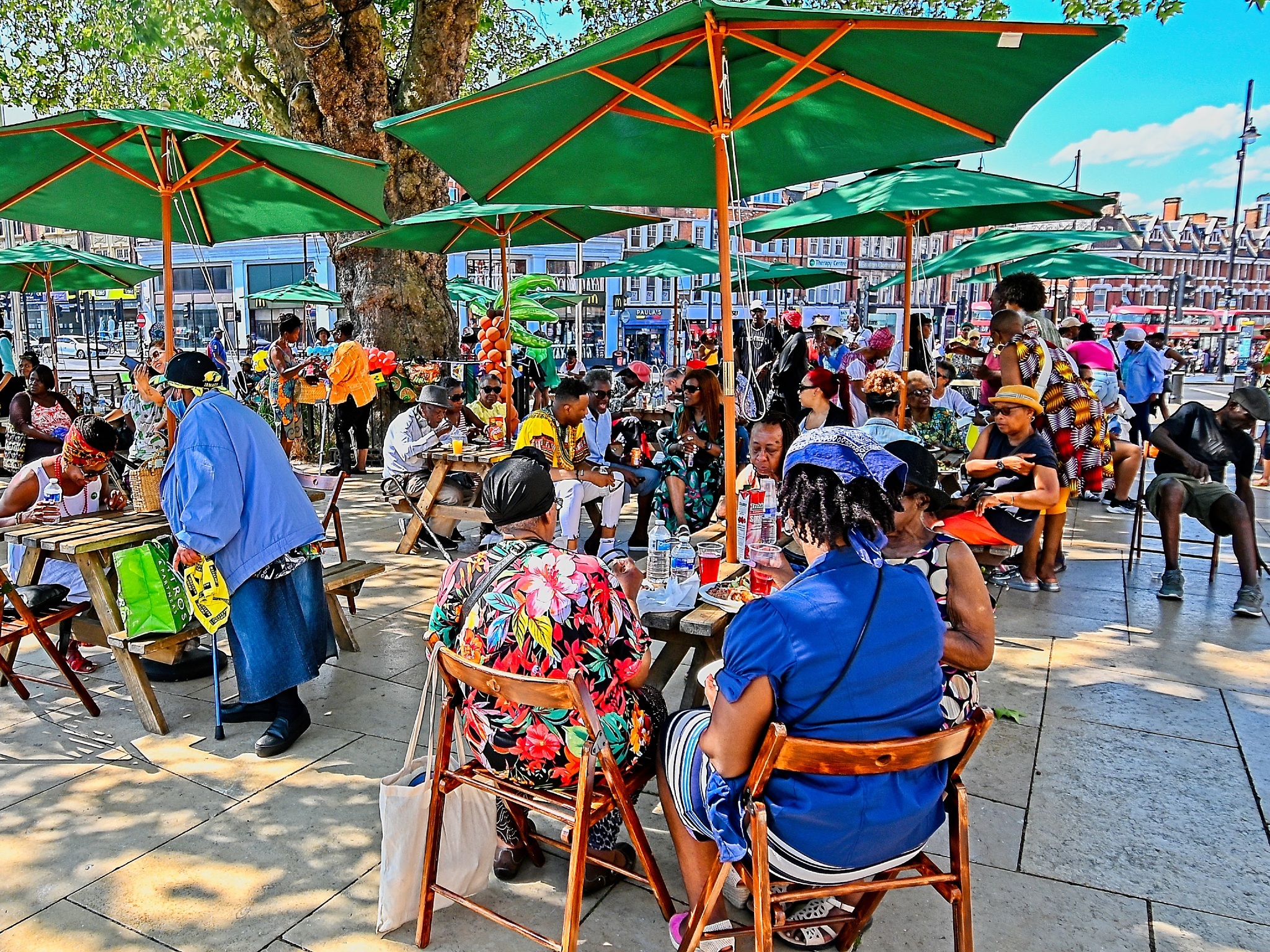 Attendees sit down for lunch in Windrush Square