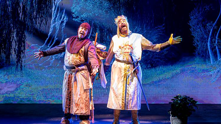 Spamalot Two men dressed in medieval attire on stage performing