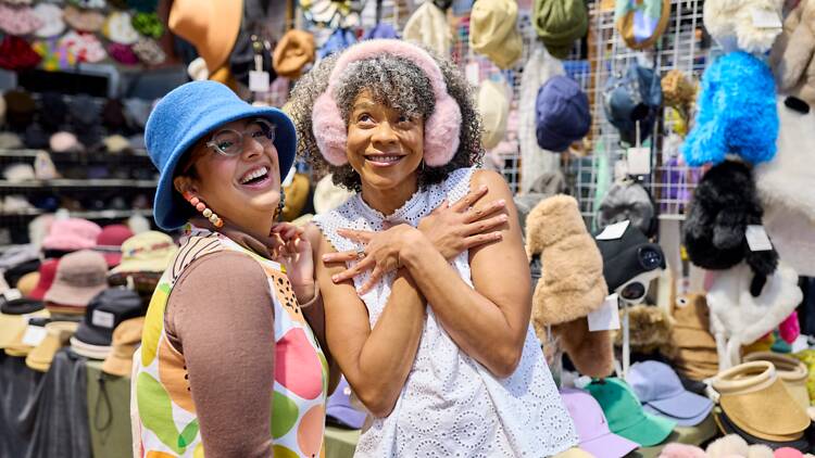 Queen Victoria Market Two women wearing a hat and ear muffs