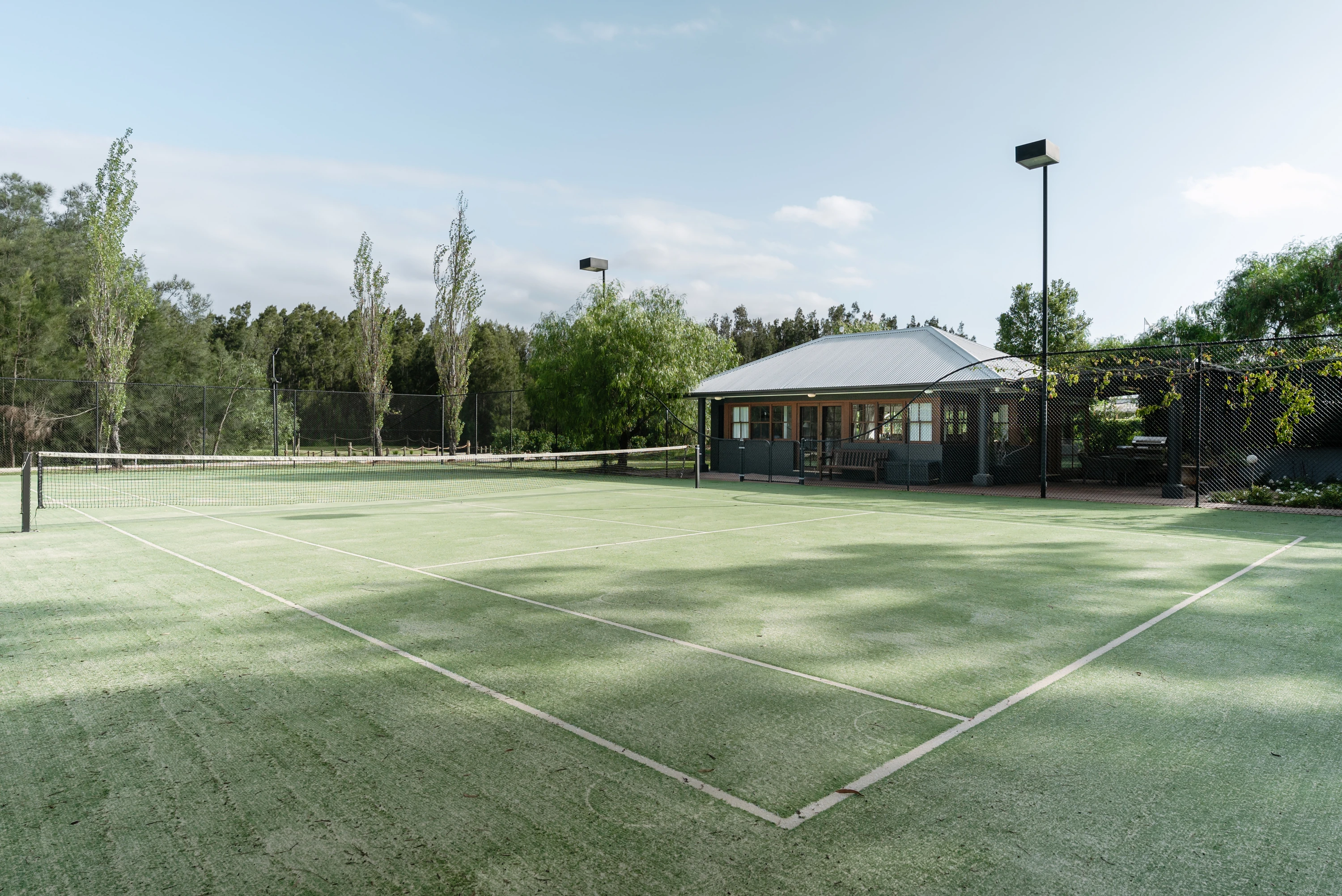 The tennis court at McGuigan House