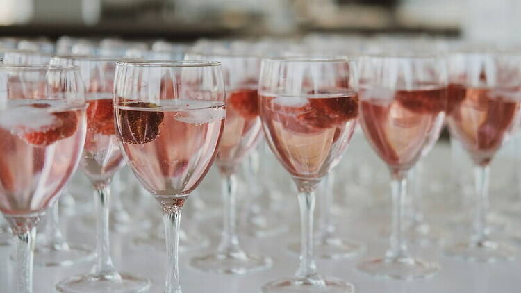 A close-up of wine glasses filled with wine. A close-up of wine glasses filled with wine.