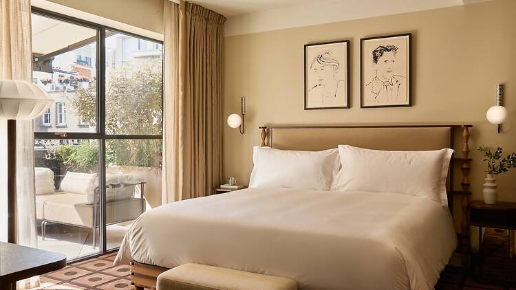 A bedroom with a private terrace at The Newman