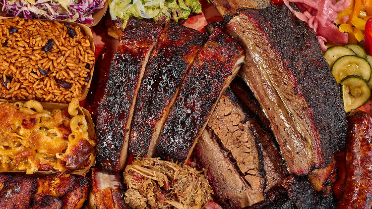 Bark Barbecue A plate of barbecue, rice and beans and mac and cheese