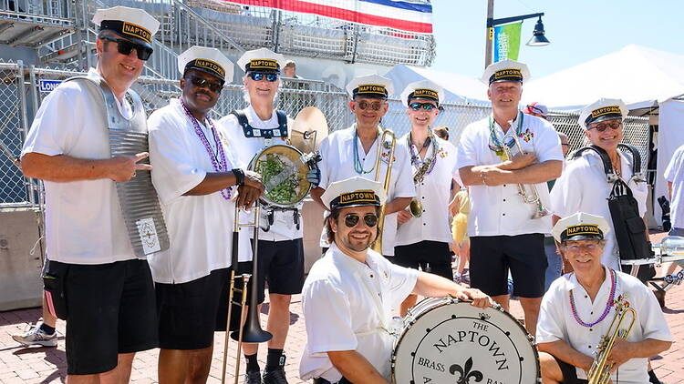Wide shot of a brass band posing with their instruments Wide shot of a brass band posing with their instruments