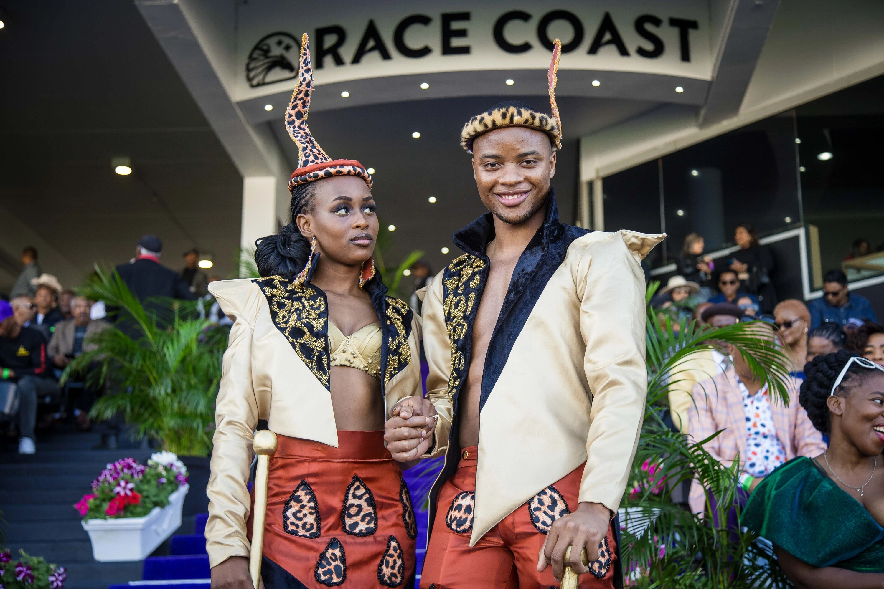 Karabo Bapela and Mike Danisa (left to right) are a striking couple at the Hollywoodbets Durban July at Hollywoodbets Greyville Racecourse on Saturday 4th July.