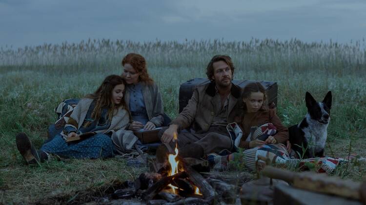 Little house on the Prairie first look, episode 1 the ingalls family in front of a campfire in Little house on the Prairie first look, episode 1