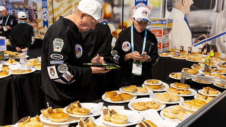 Fine Food Australia Two people judging a pie competition