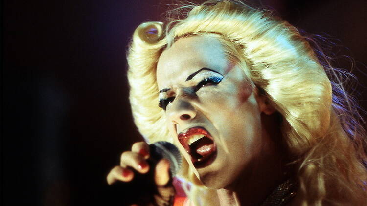Close-up view of a person singing in a microphone Close-up view of a person singing in a microphone
