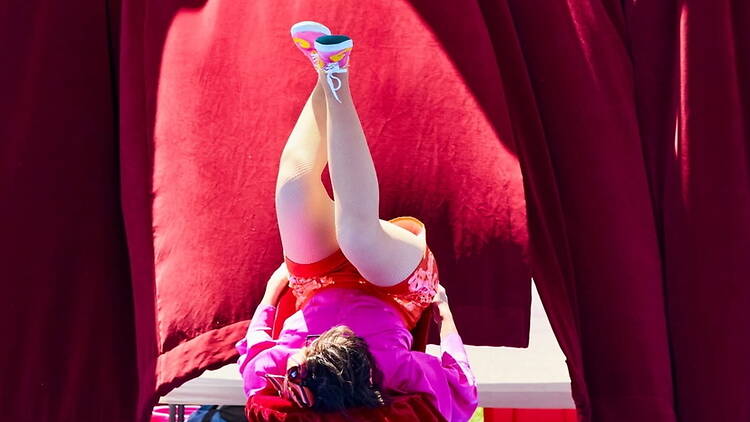Medium close-up of a person upside down in a stage Medium close-up of a person upside down in a stage