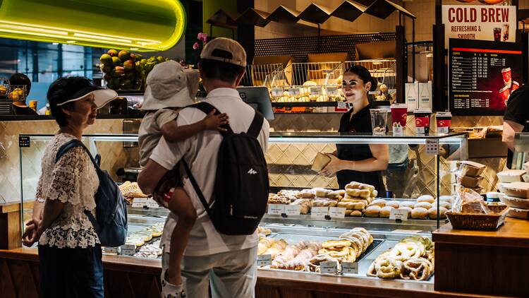 Sydney Fish Market A family buying food at a market