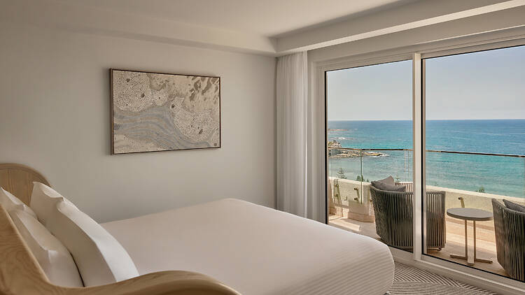 A hotel room with bed