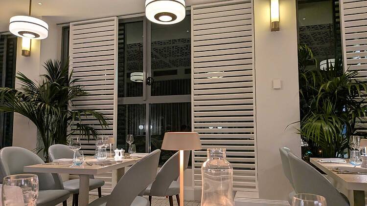 a hotel restaurant with shutters