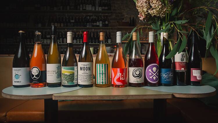 bottles of different wines lined next to each other