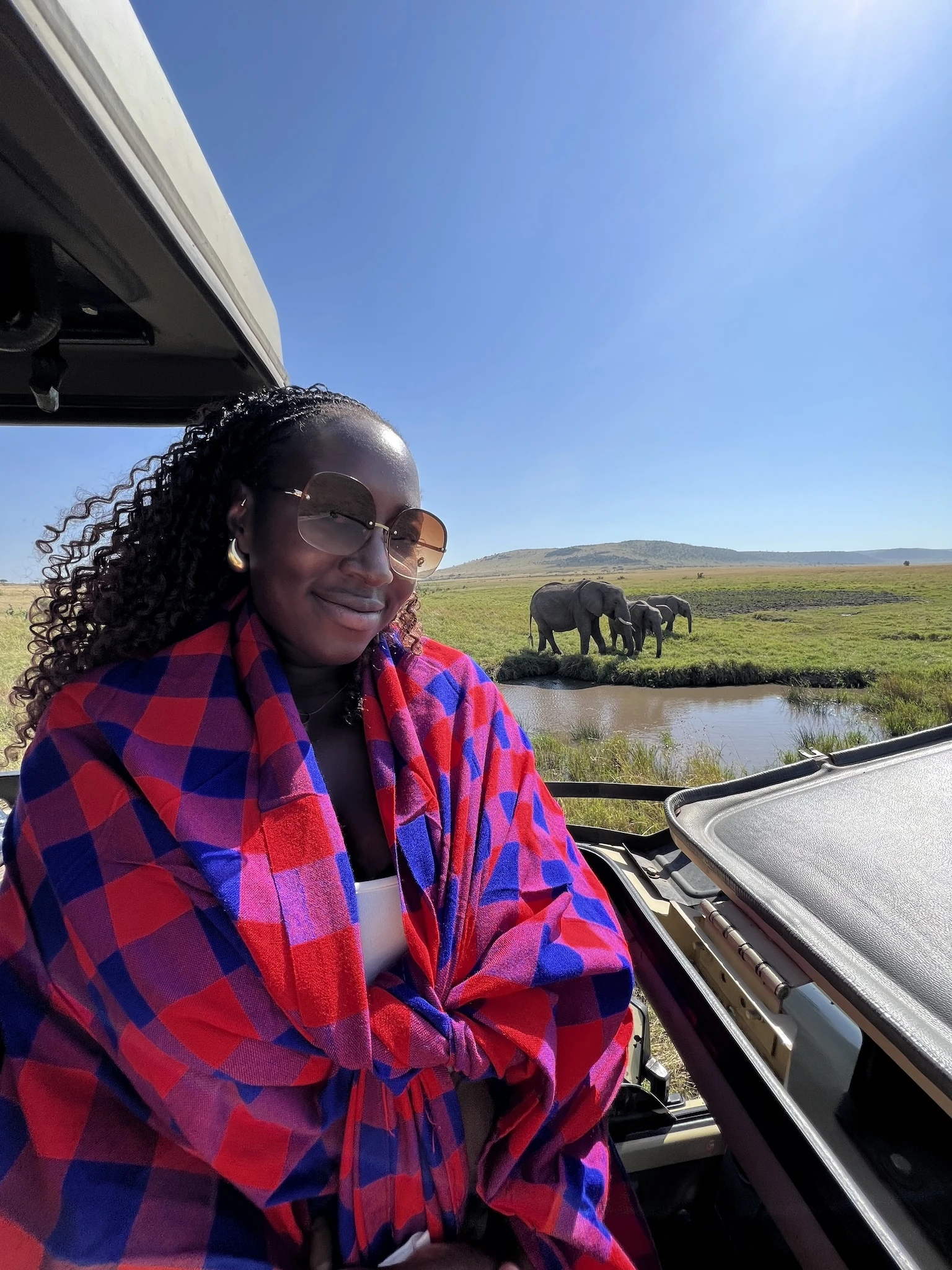 Vivienne on the Maasai Mara with elephants in background
