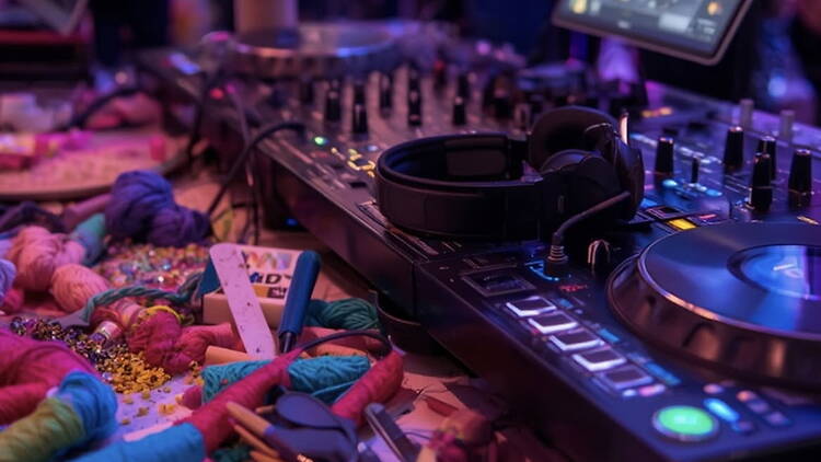 Close-up of DJ equipment set up on a performance table. Close-up of DJ equipment set up on a performance table.