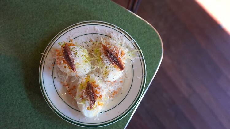 A plate of three Caesar Salad Deviled Eggs
