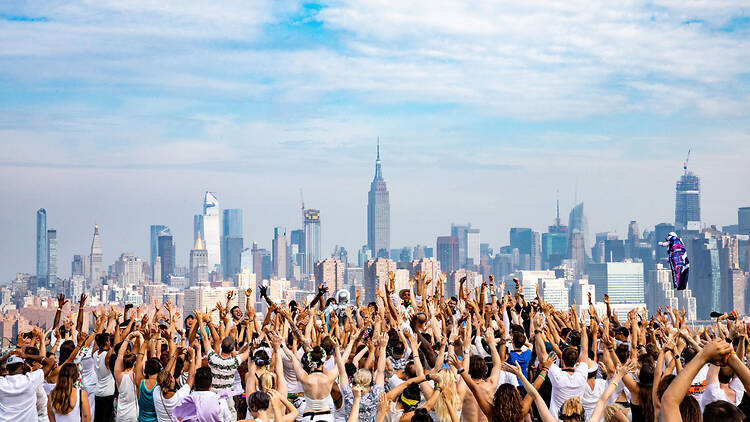 Daybreaker dance party overlooking the Manhattan skyline Daybreaker dance party overlooking the Manhattan skyline